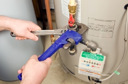 Casas Adobes Arizona plumber repairing hot water heater